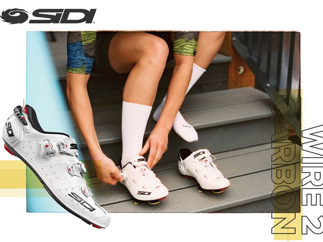 A white Sidi Wire 2 Carbon is shown in side-profile over an image of a road cyclist putting on the shoes while sitting on a set of stairs.